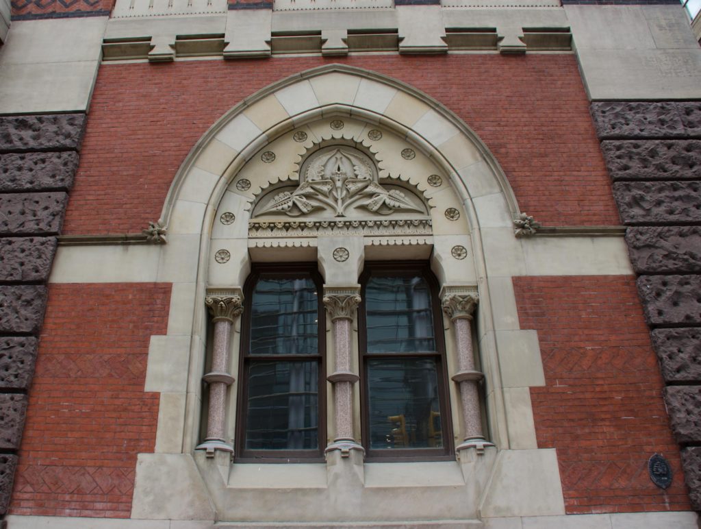 More floral ornamentation on the windows at the front of the building